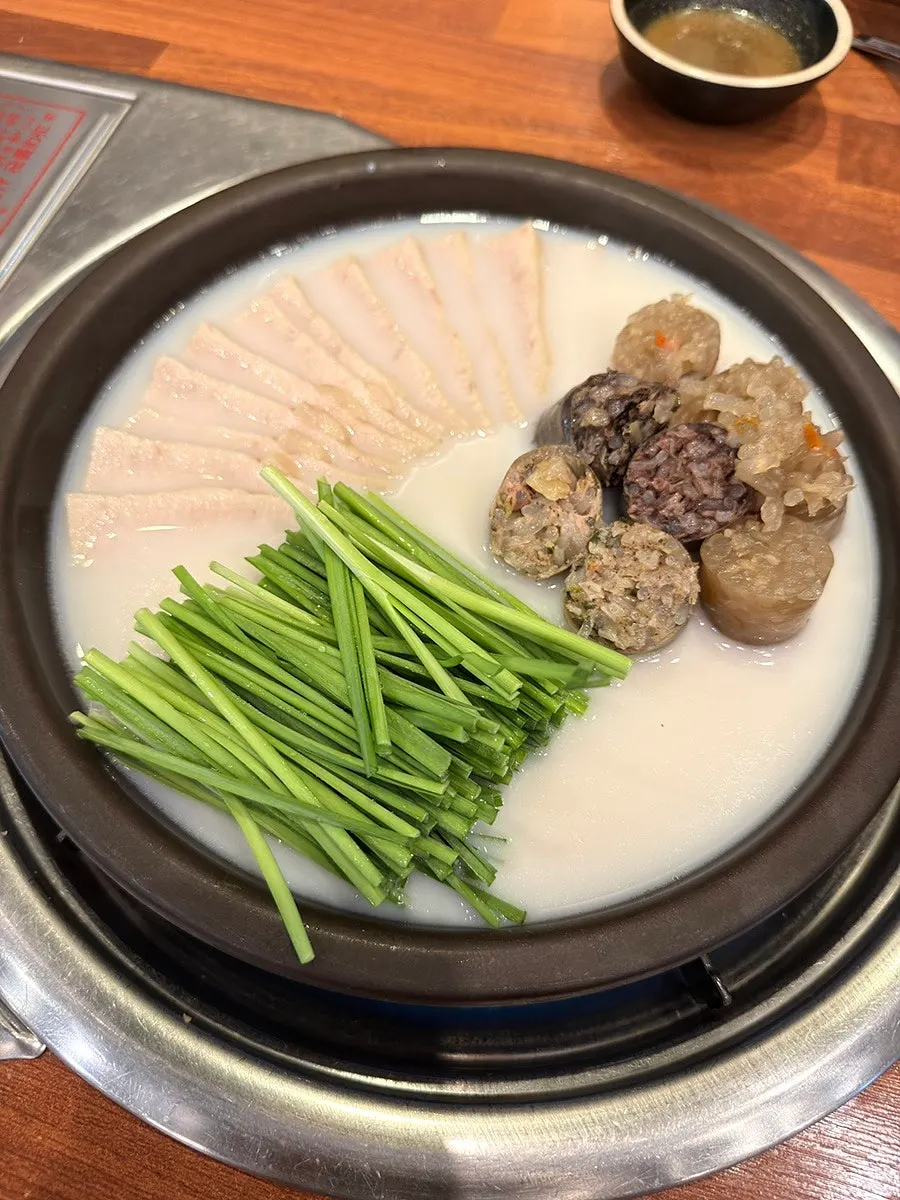 Table with gukbap and boiled meat set together