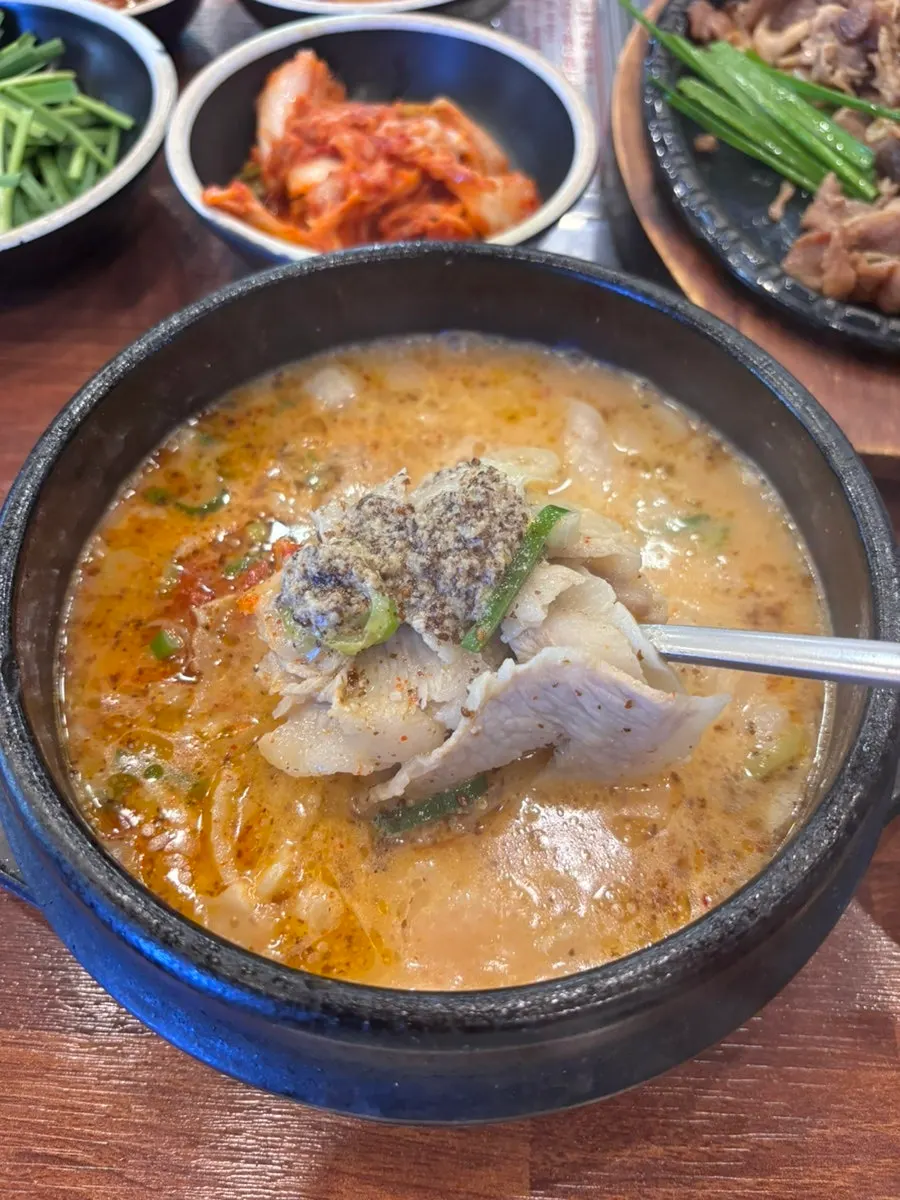 Table with gukbap and side dishes together