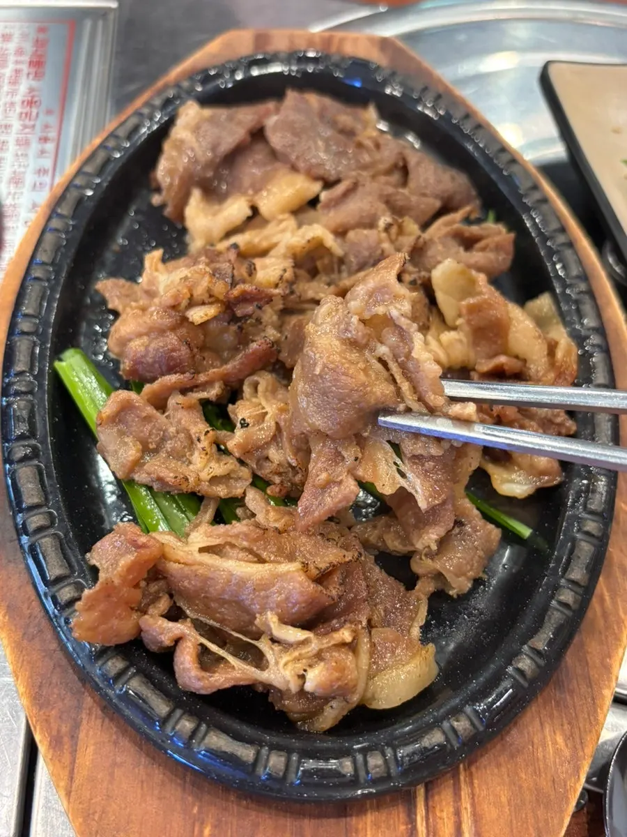 Close-up of smoky fire-grilled pork