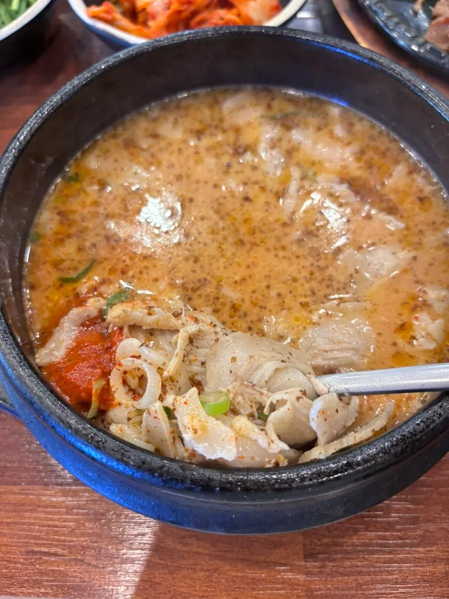 Gukbap topped with thinly sliced pork jowl