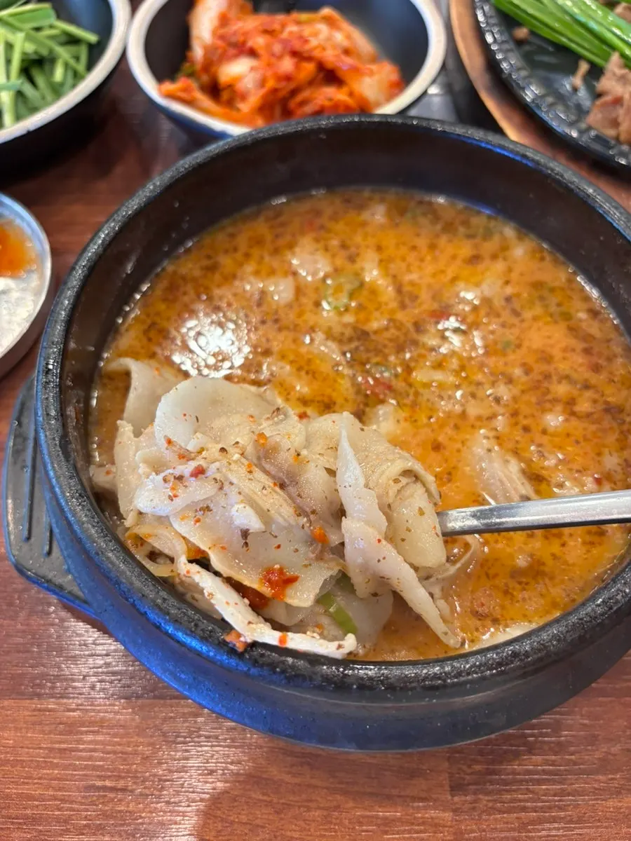 Rice mixed into the broth of pork jowl gukbap