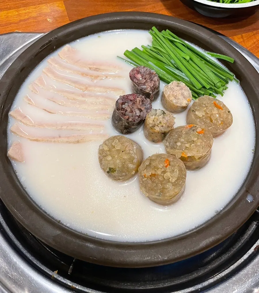 Plate of bossam, chives, and sundae served together