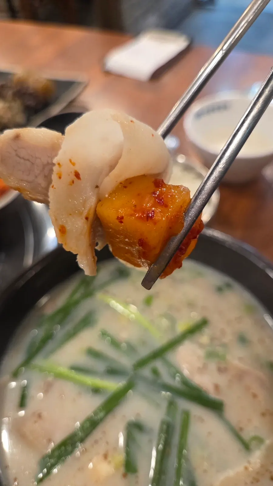 A bowl of gukbap with milky bone broth