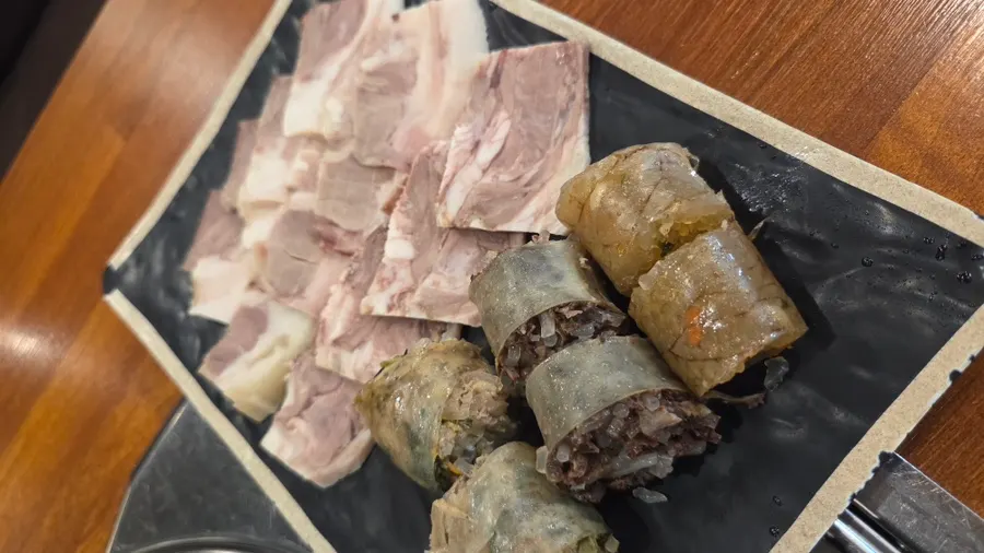 A full spread with gukbap and set meal served together