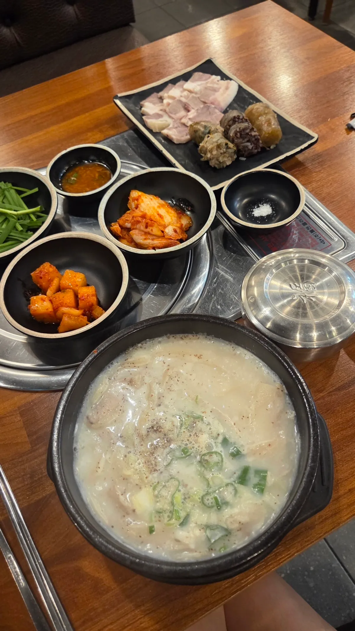 The solo set meal served with gukbap, three types of sundae, and boiled pork
