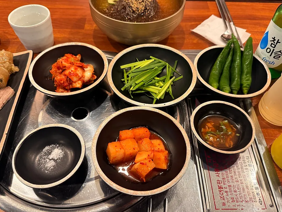 Basic side dishes including diced radish kimchi and fresh-tossed kimchi