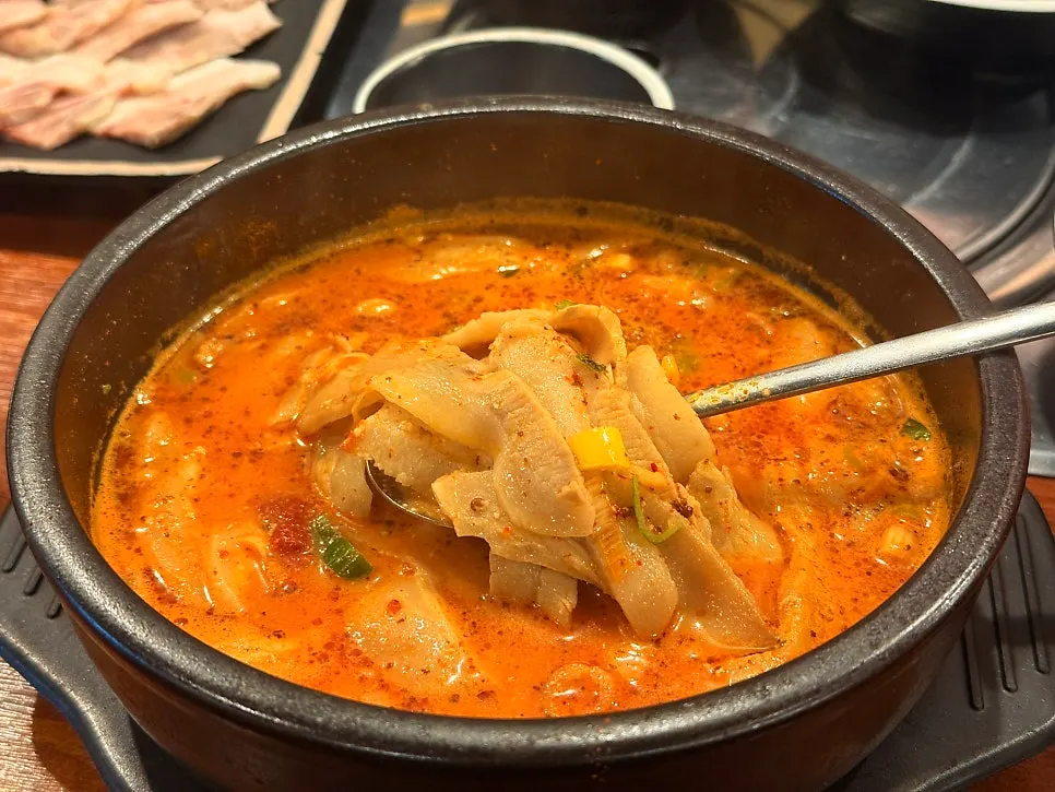 Spicy pork jowl gukbap loaded with pork jowl meat