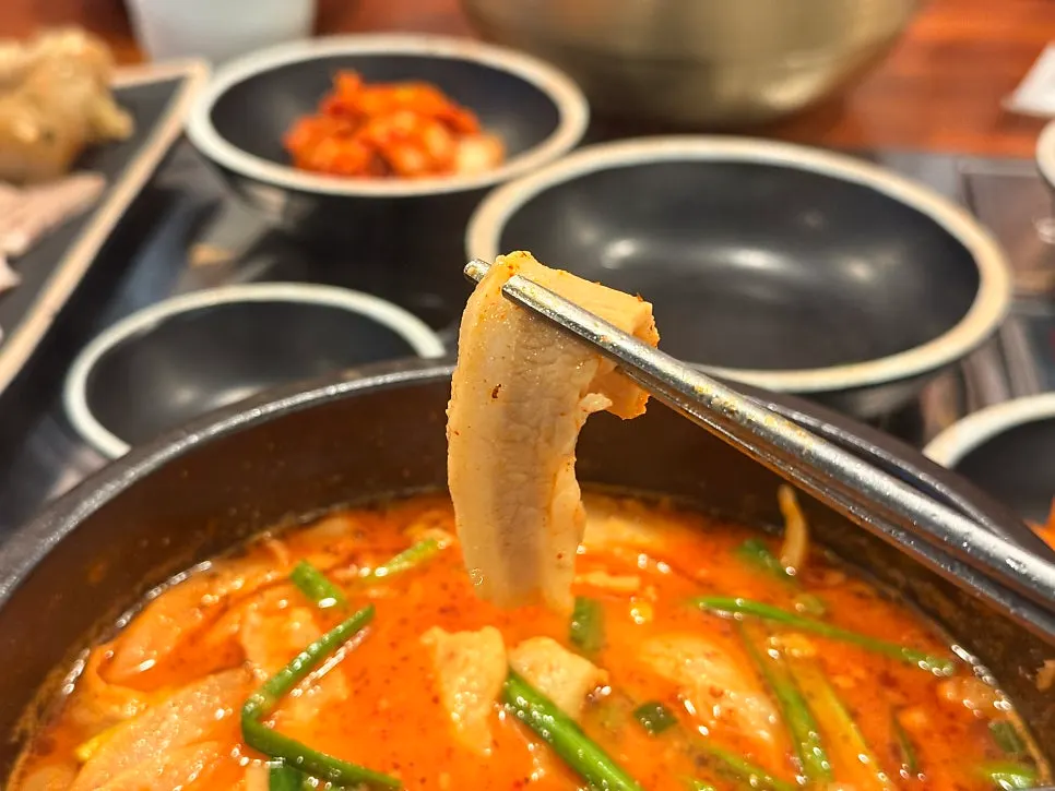 Close-up of the tender pork jowl meat inside the gukbap