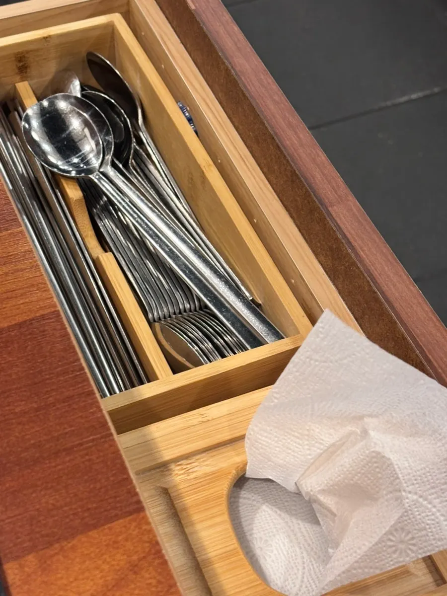 Spoons and napkins inside the table drawer