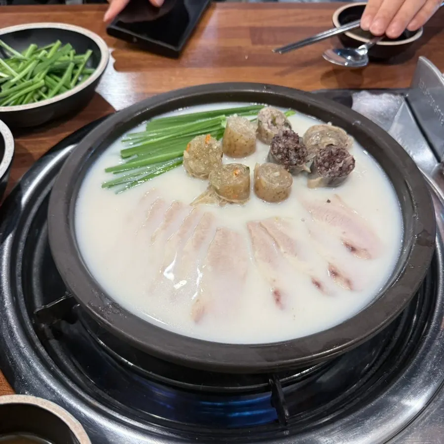 Menu board showing pork jowl sujuk price