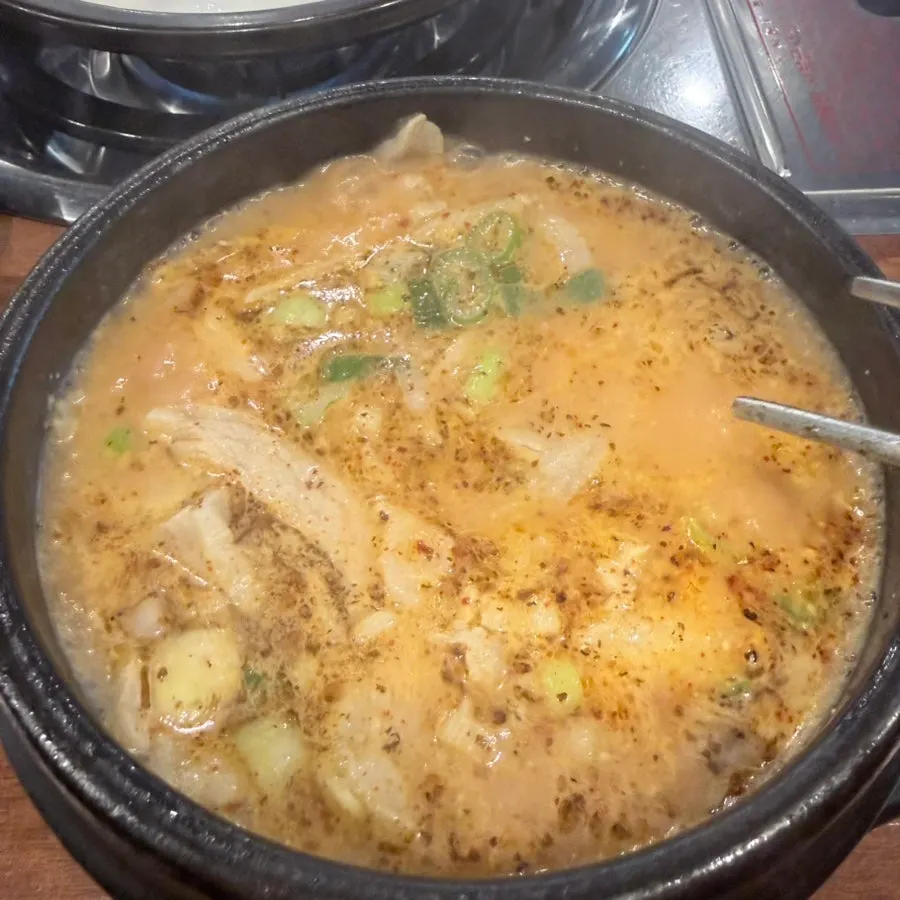 A bowl of pork jowl sujuk gukbap loaded with meat