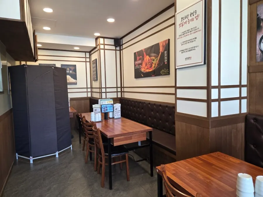 Sign for the sundae and pork gukbap specialty restaurant with the soju event notice