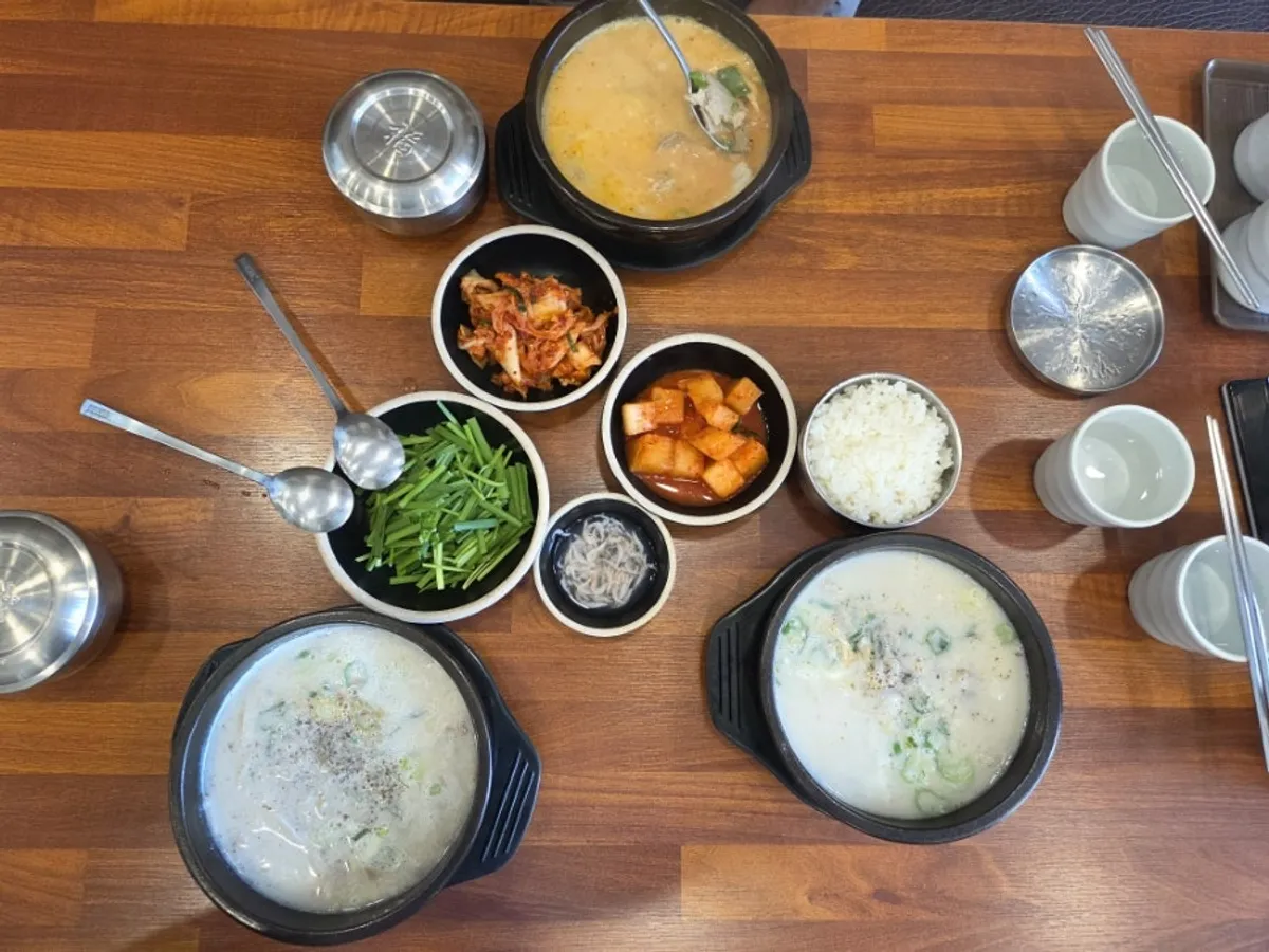 A bowl of spicy pork gukbap with red broth