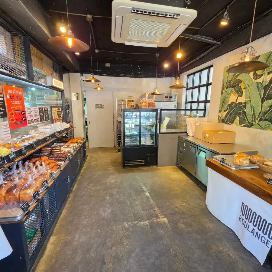 Bread display shelves inside Boulangerie Copain