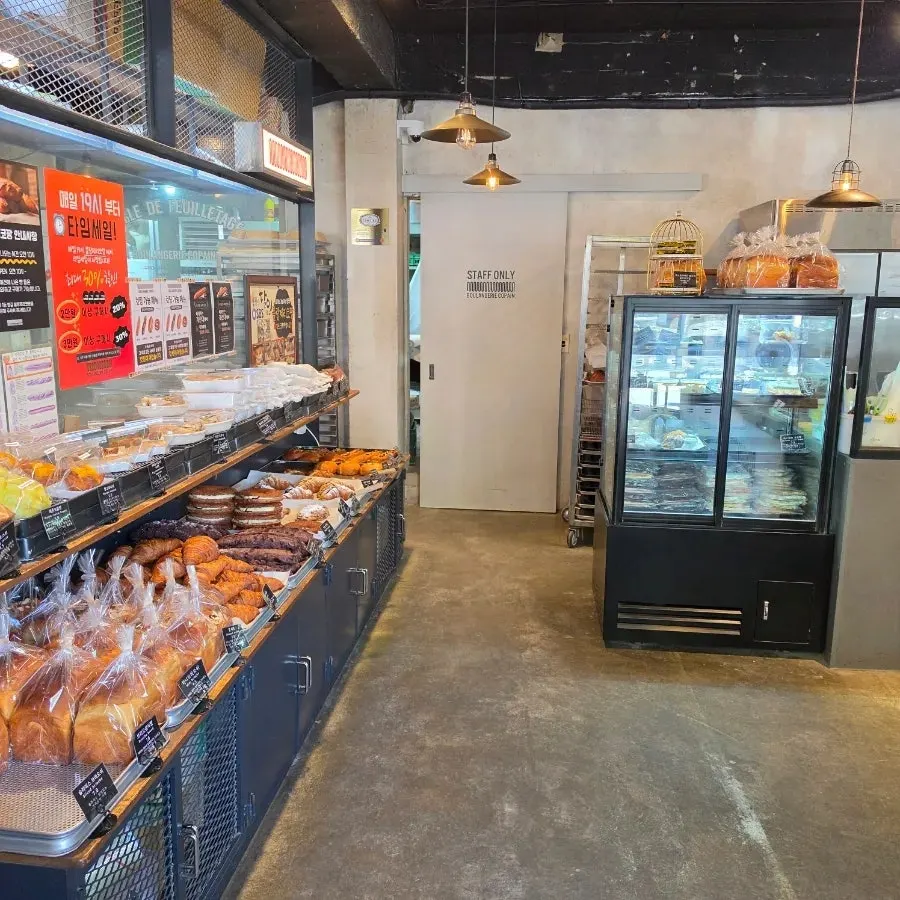 Interior of the store where customers pick bread with trays