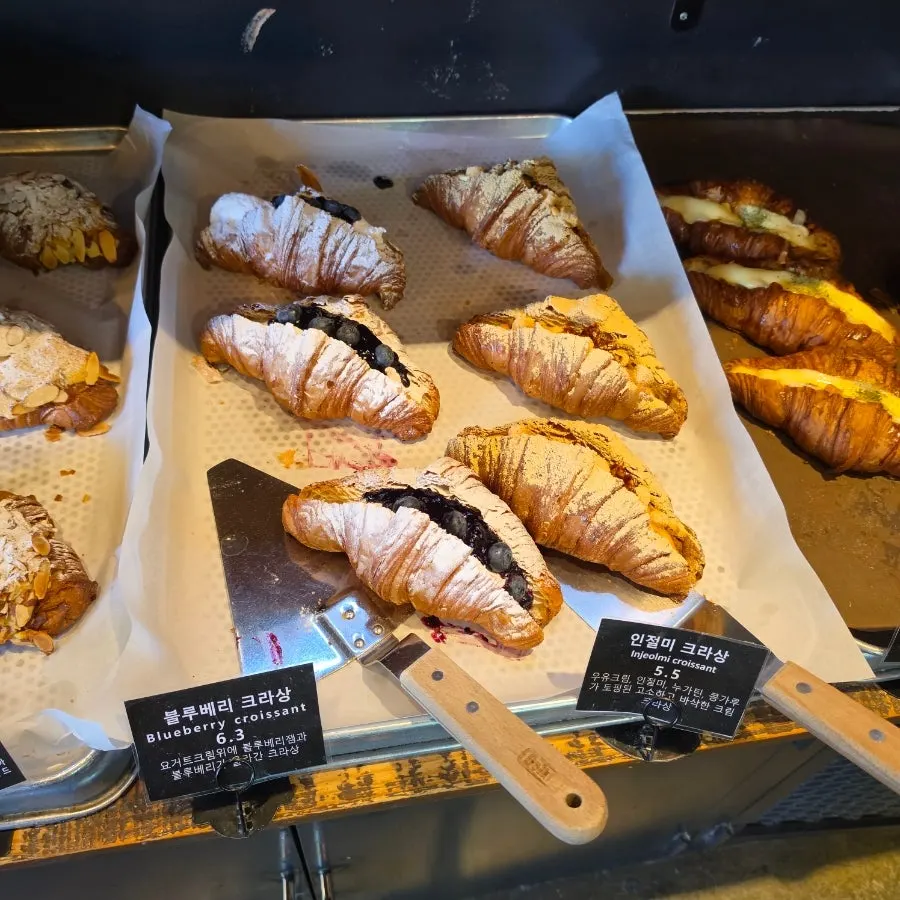 Cream breads displayed in the refrigerated corner