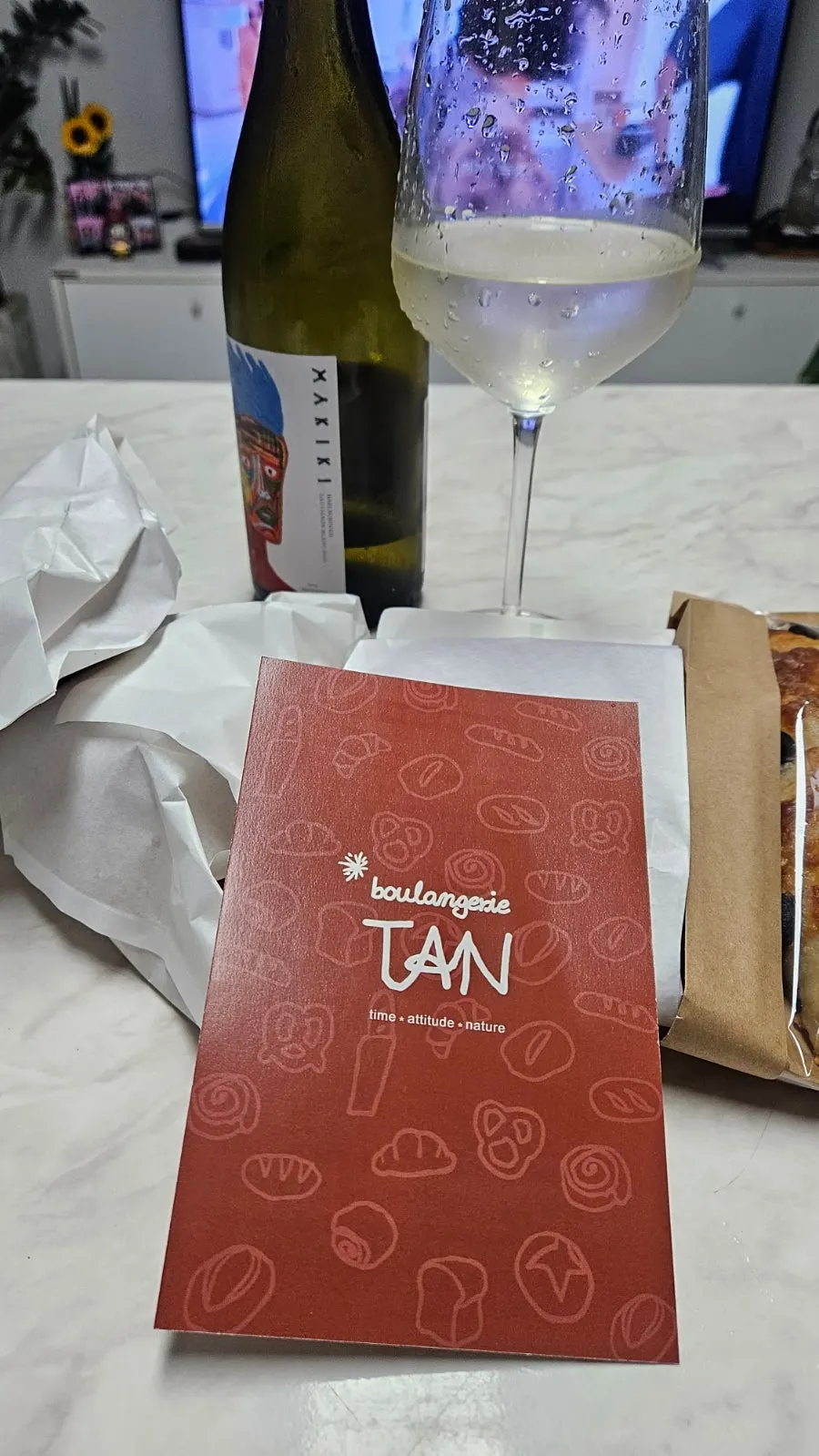 Boulangerie Tan bread laid out with wine at home