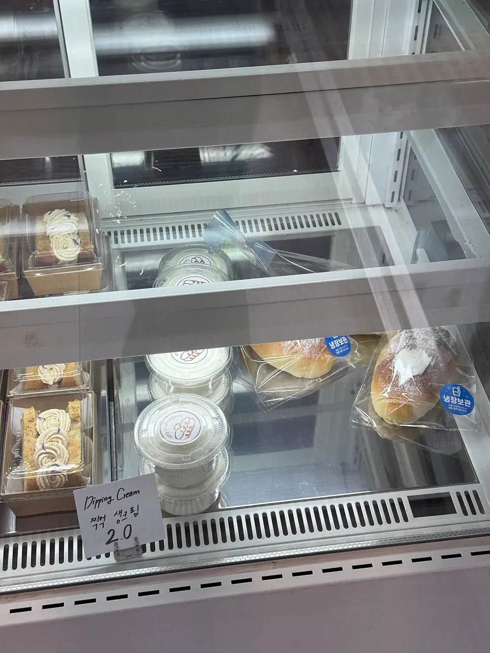 Showcase with tiramisu and fig chiffon cake