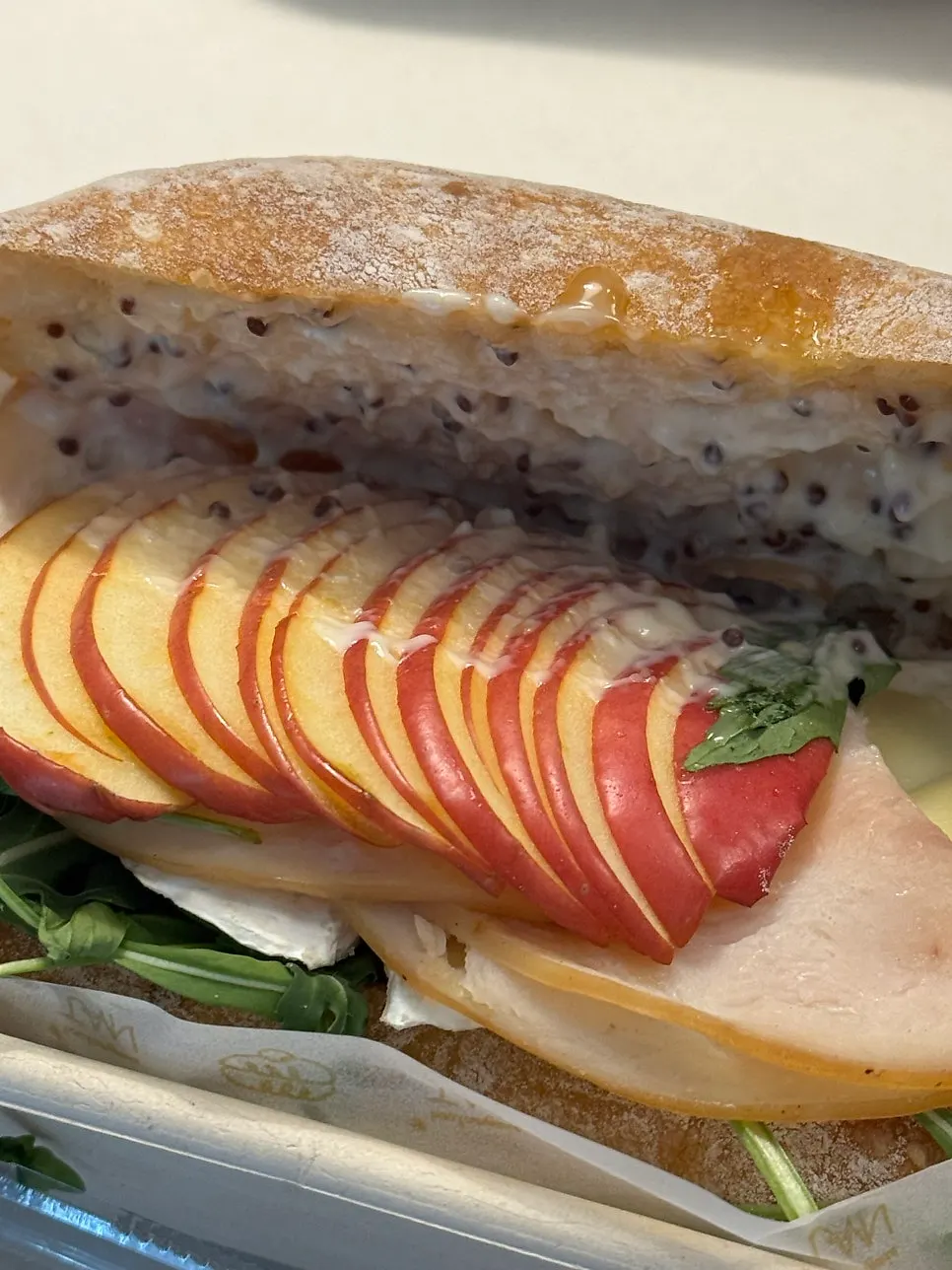 Unwrapped apple brie ciabatta sandwich