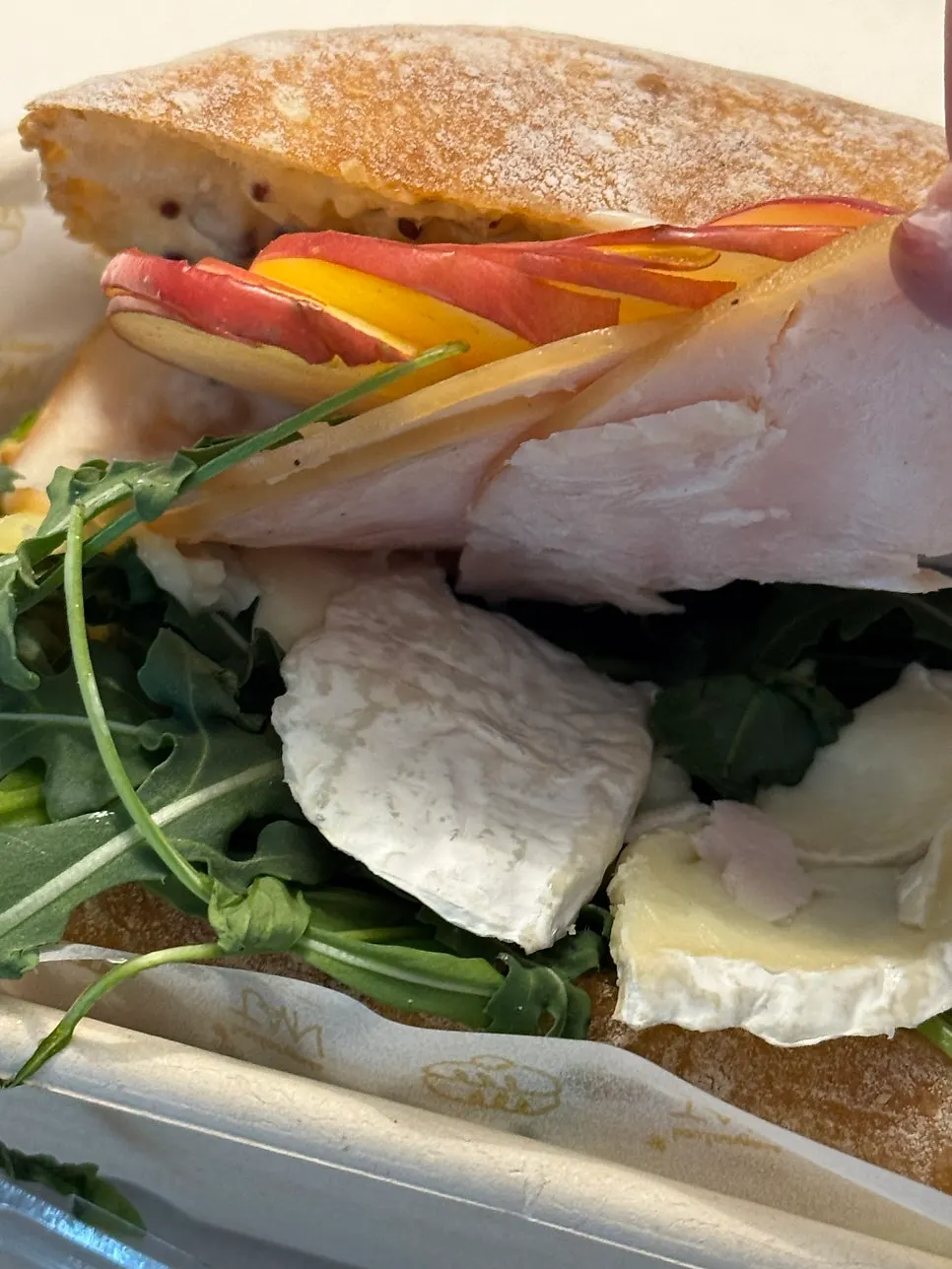 Cross-section of the sandwich showing apple and brie cheese
