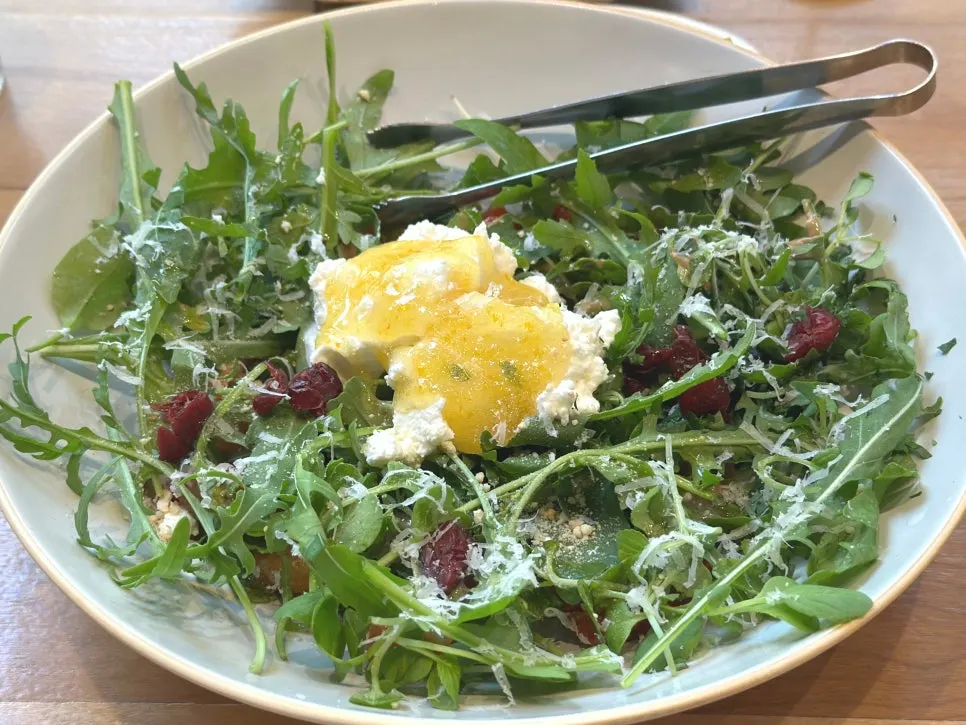 Close-up of salad with yuzu dressing and cranberries
