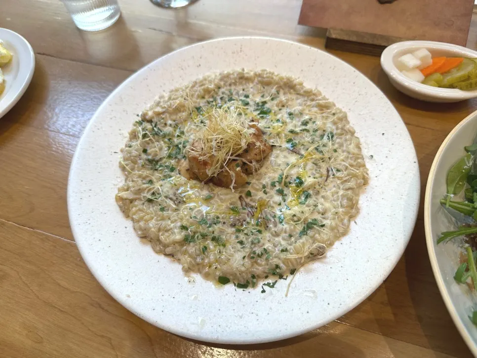 Cream barley risotto topped with roast chicken