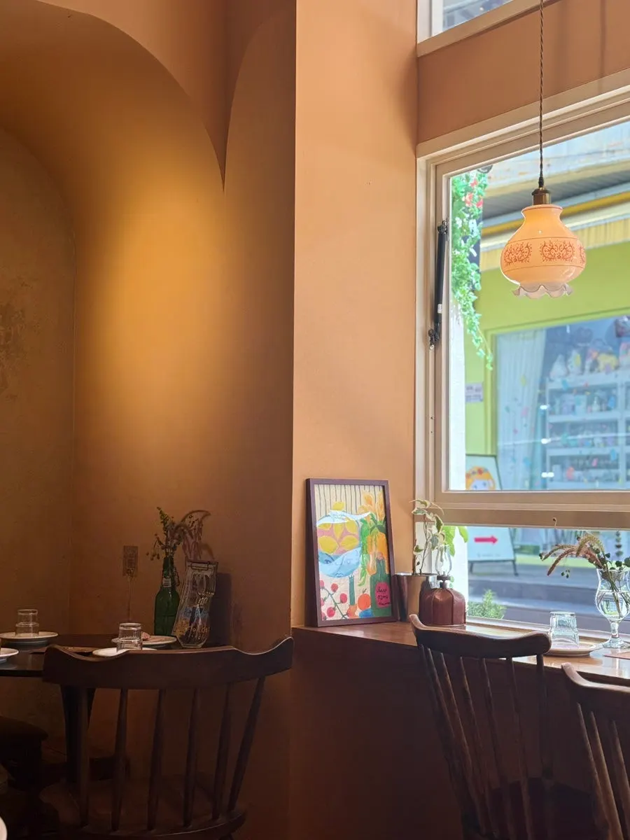 Orange and brick-colored interior detail at Brassway