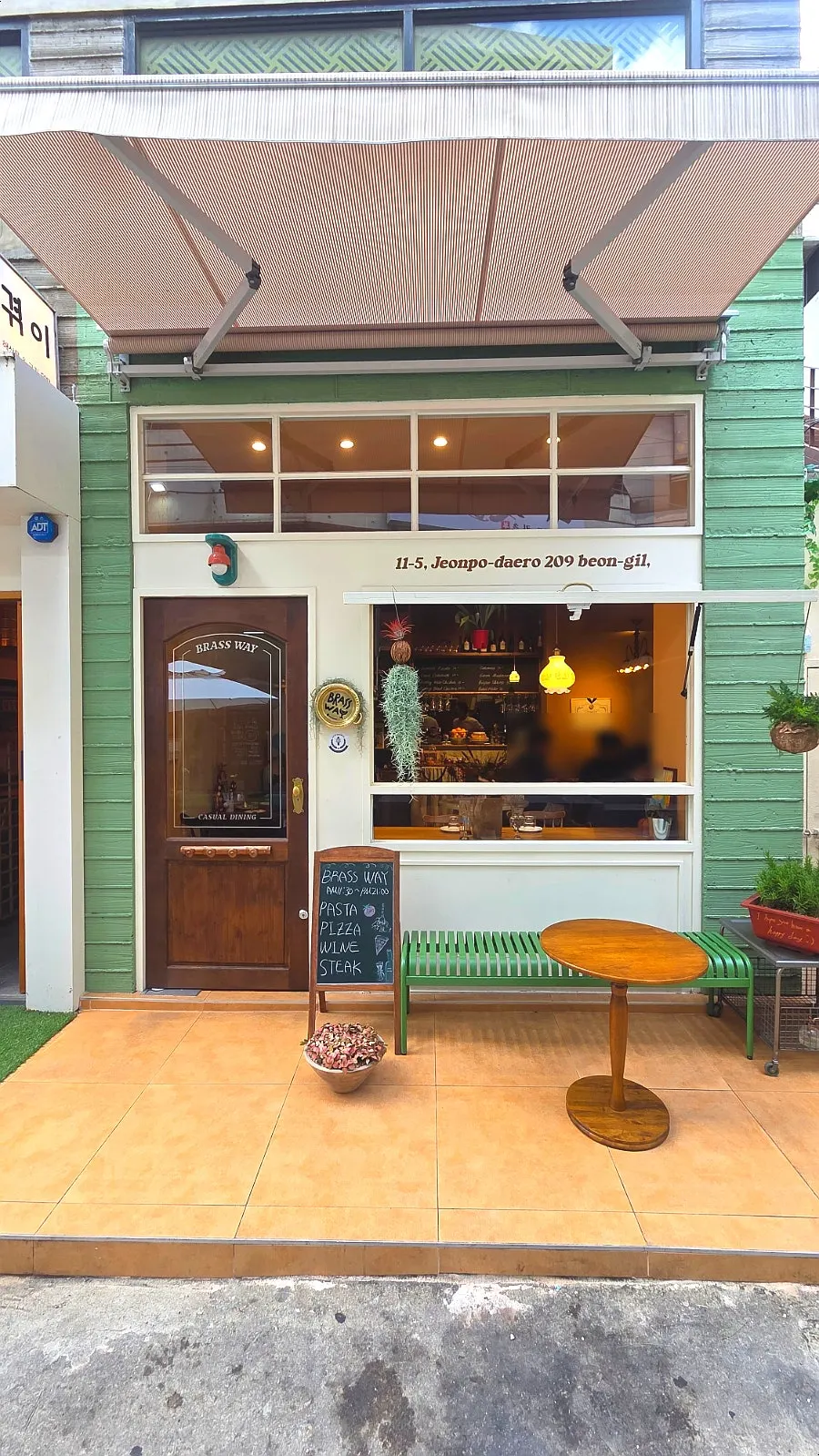Brassway space in Jeonpo decorated with plants and knickknacks