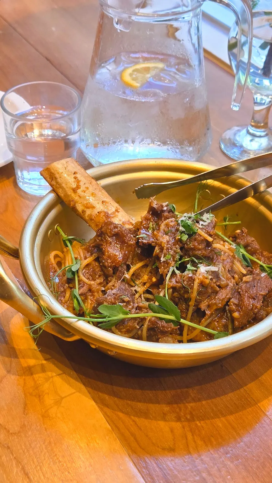 Brassway galbi pasta topped with a large galbi bone