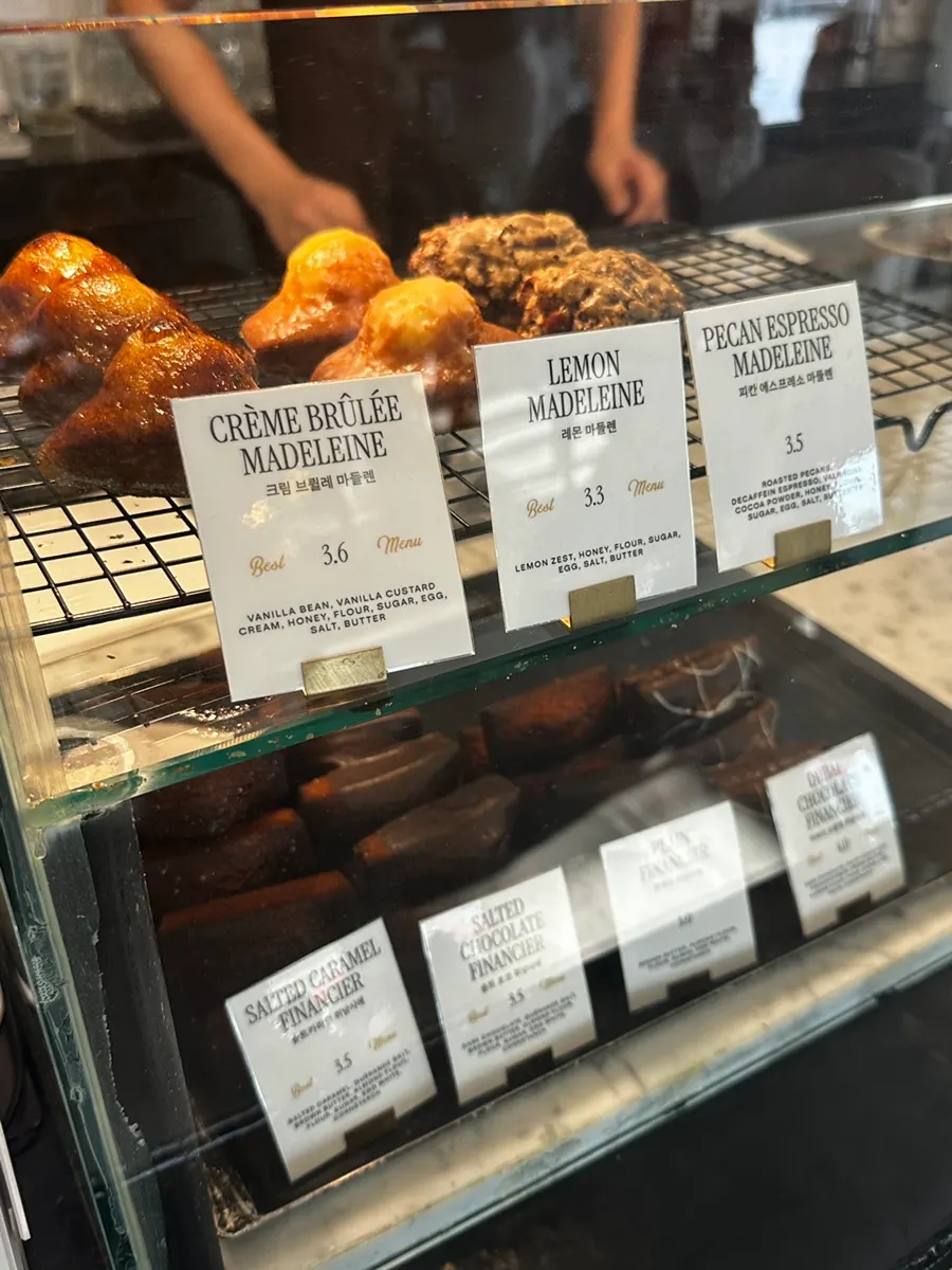 Madeleines and financiers displayed in the Brewers Coffee showcase