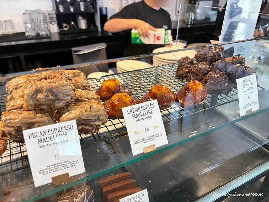 Display case with financiers and madeleines
