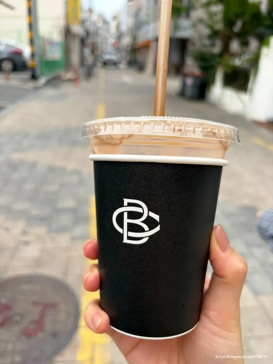 Takeout cup of Brewers Coffee mocha latte