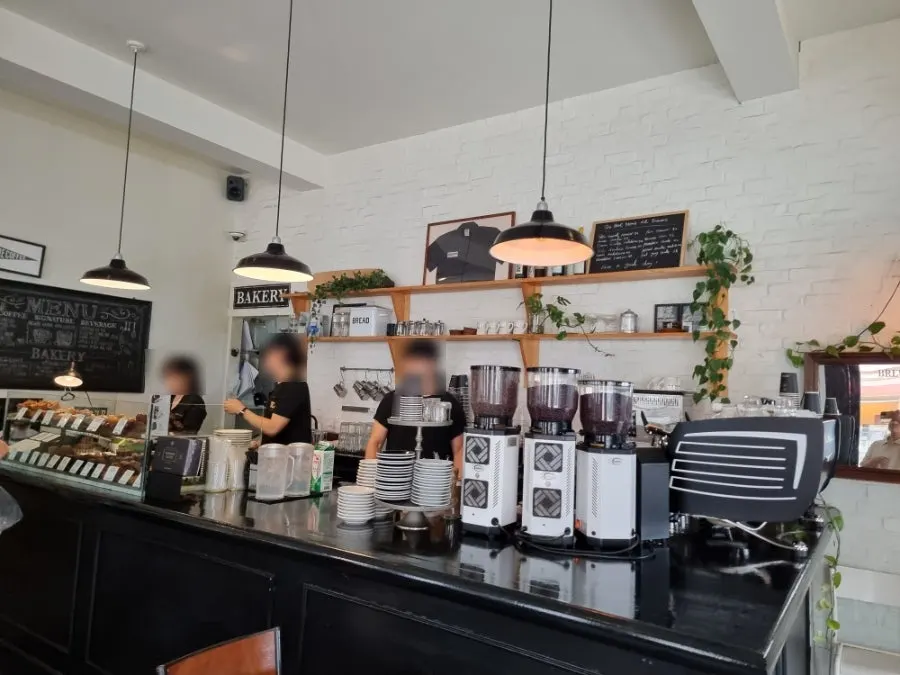 Order counter and dessert display at Brewers Coffee