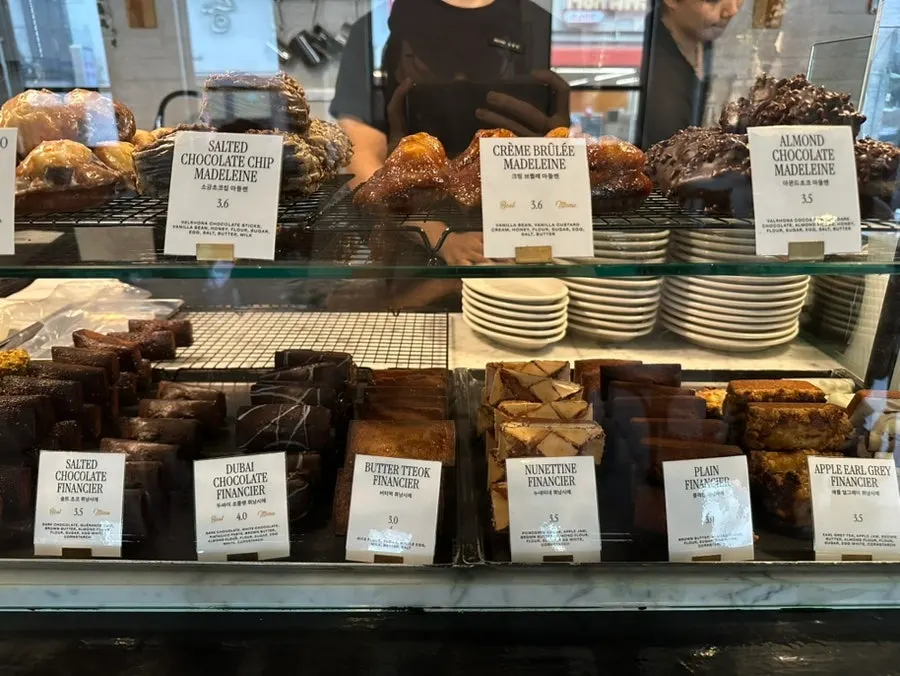 Financiers and madeleines lined up in the bakery corner
