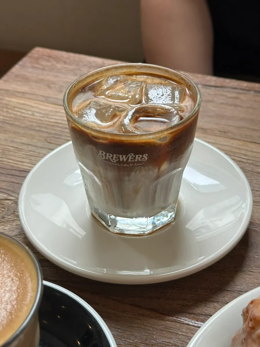 Close-up of 041 coffee topped with walnut cream