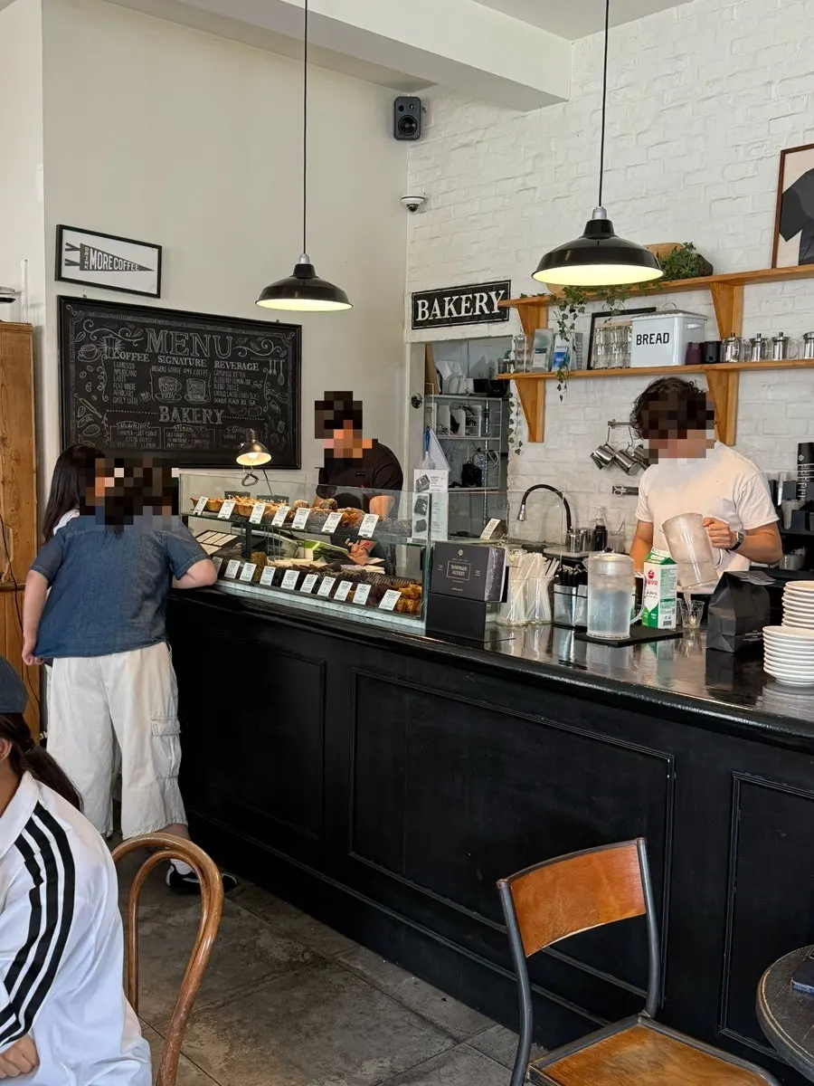 Baked goods showcase stocked with pastries at Brewers Coffee