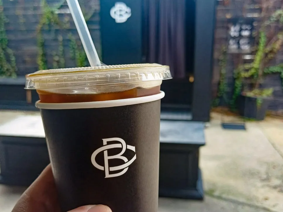 Iced americano and four desserts packed to go