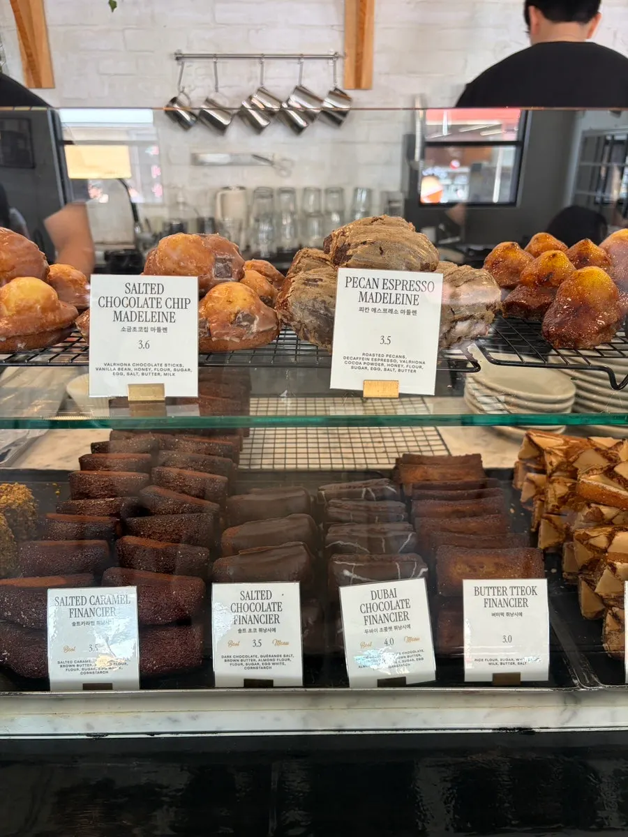 Display case with almond chocolate madeleine and financiers