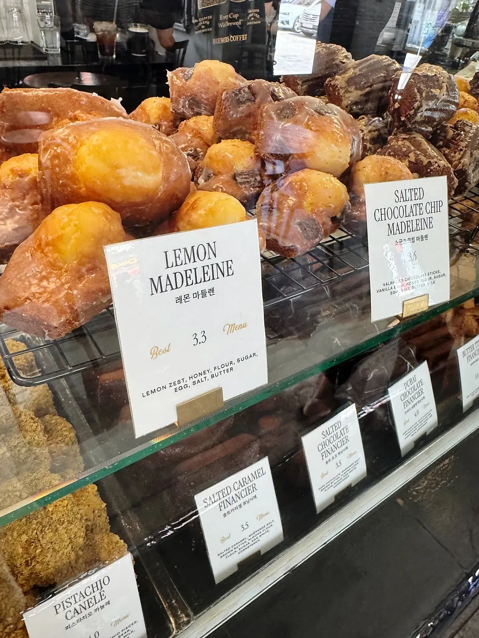 Display case with apple Earl Grey financier and more