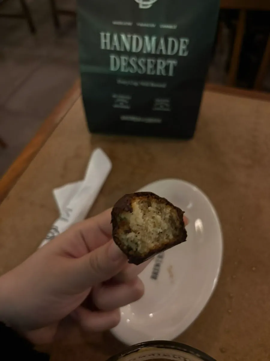 Financier eaten alternately with the Americano