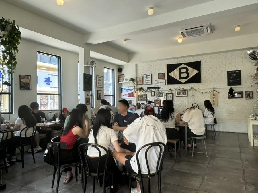 Row of 2-person tables along the wall inside