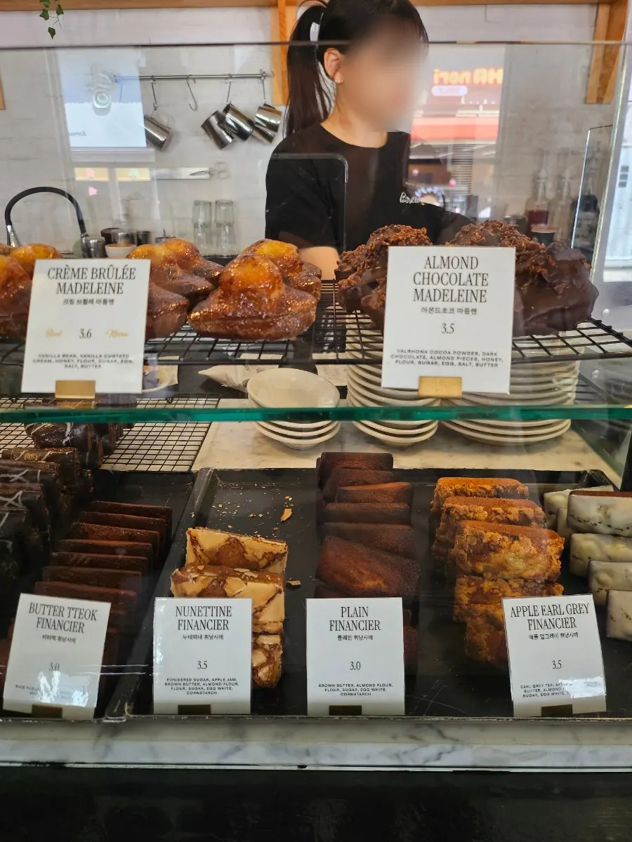 Display case of financiers and madeleines