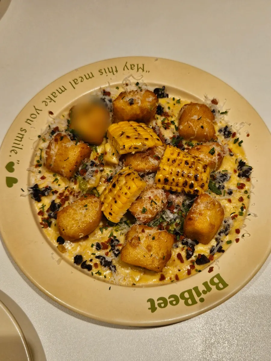 Beautifully plated green onion cream corn gnocchi