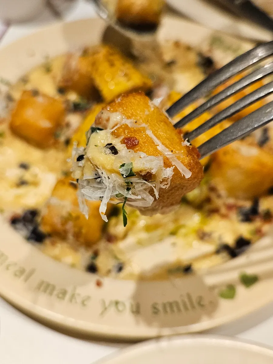House-made gnocchi topped with whole corn kernels and whole bacon