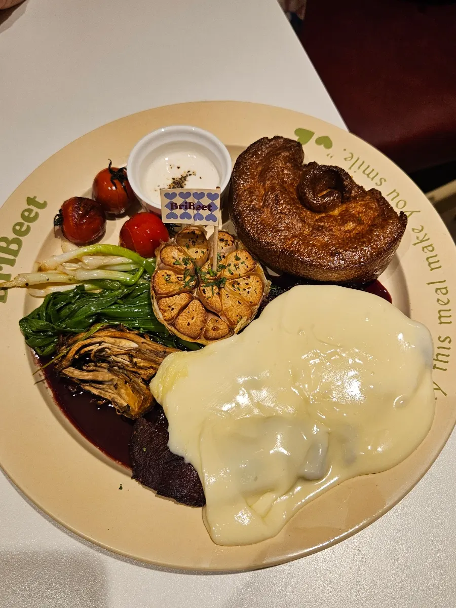 Brivit signature steak served with garnishes