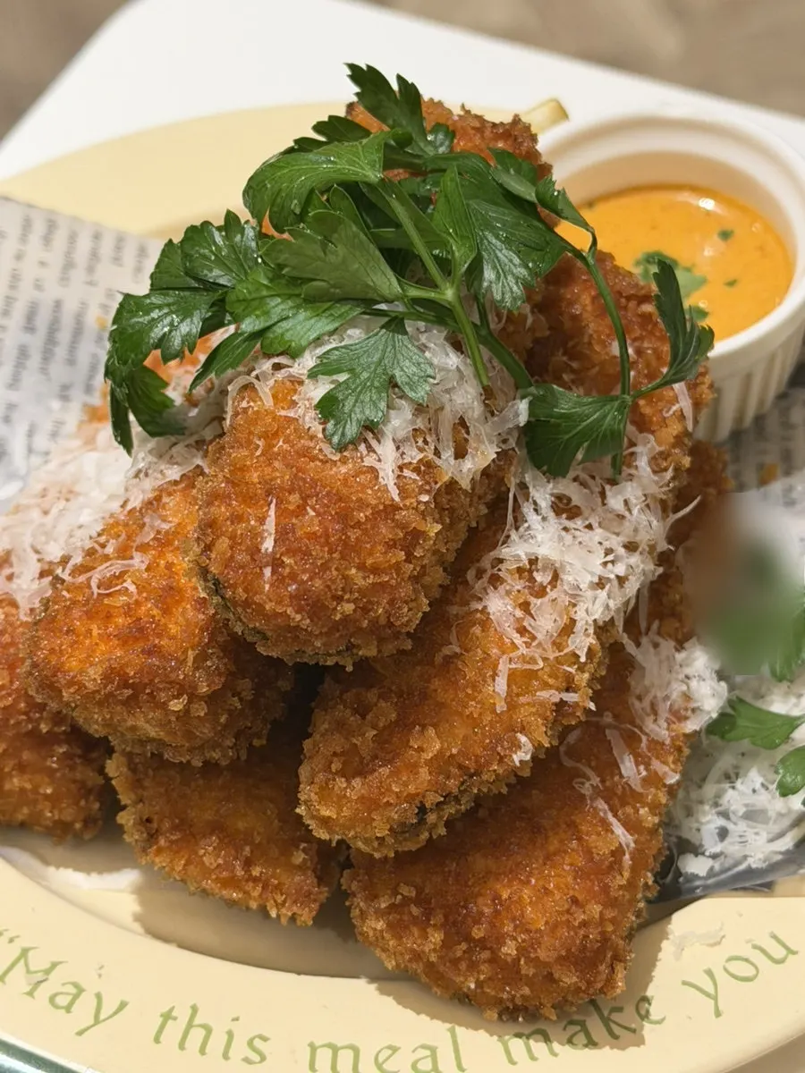 Fried eggplant served with spicy sauce