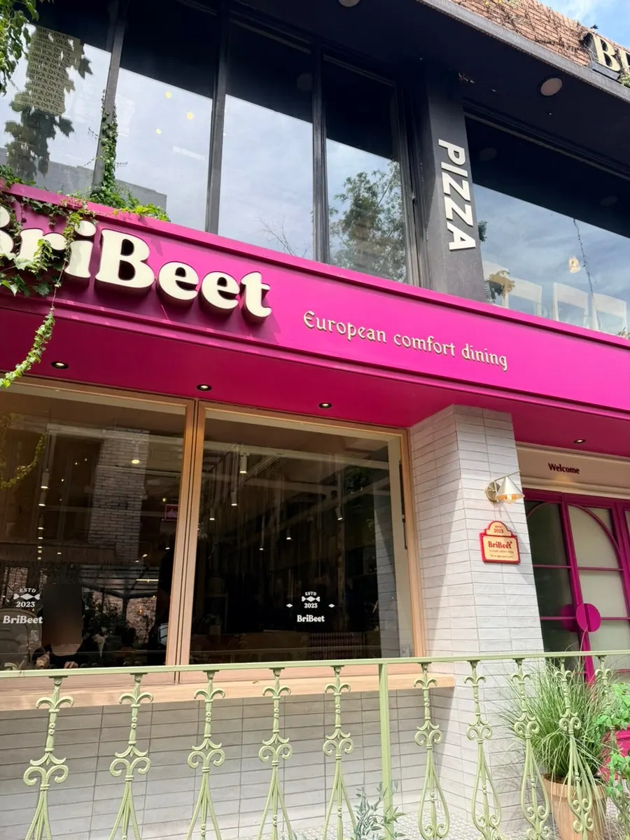 Brivit Gangnam Station's entrance with its eye-catching hot-pink color