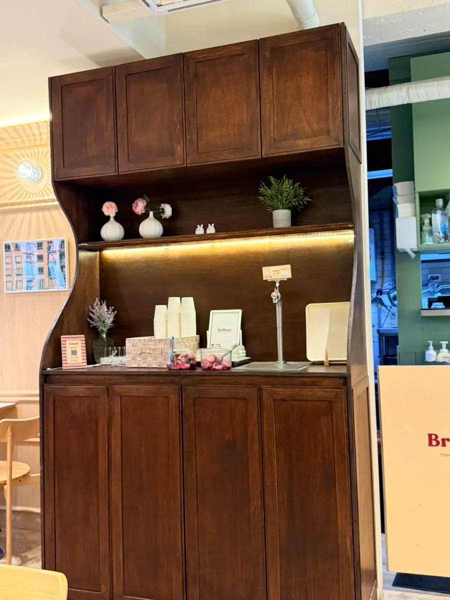 Brivit's self-serve bar set up as a wooden display cabinet