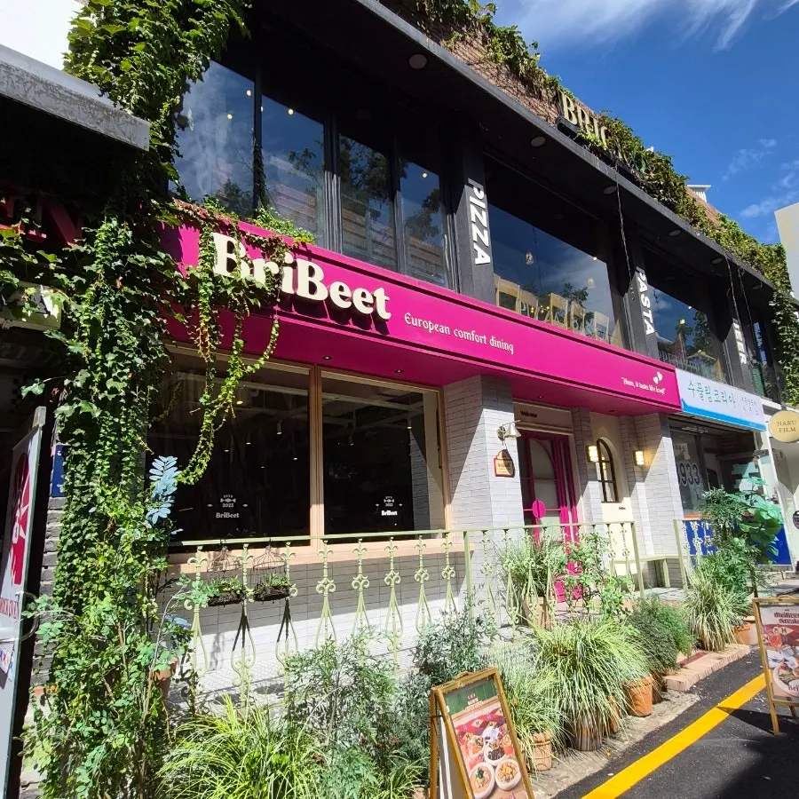 Pink-toned exterior of Brivit Gangnam Station