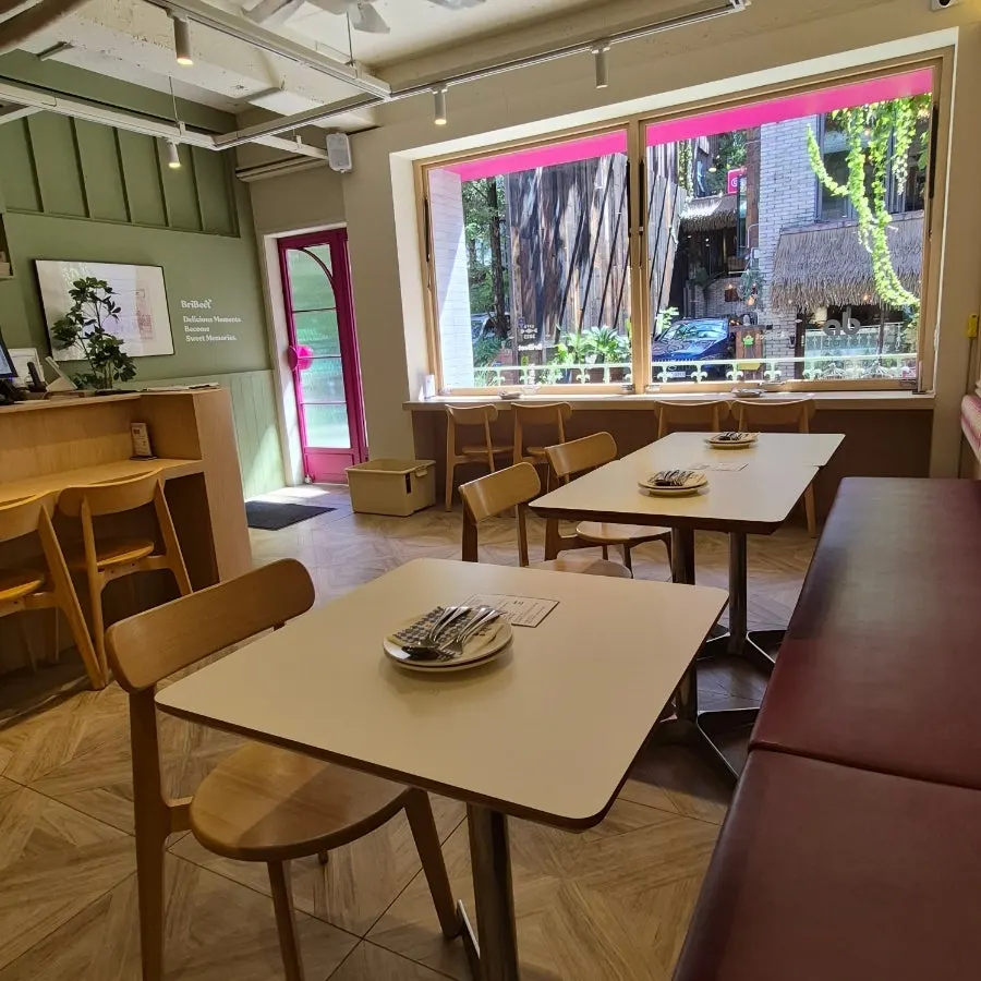 Indoor seating at Brivit with framed art and soft lighting